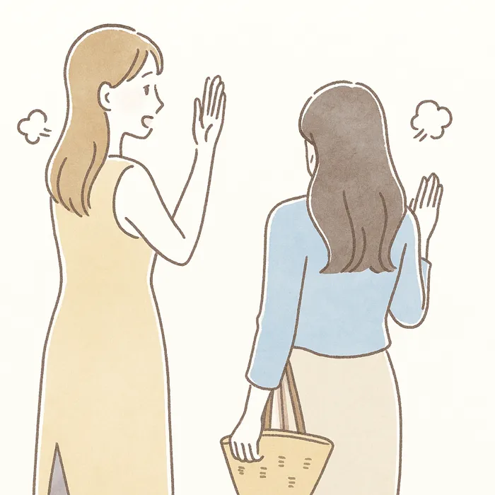 お別れの際に手を振る二人の女性